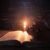 women-praying-bible-light-candles-selective-focus