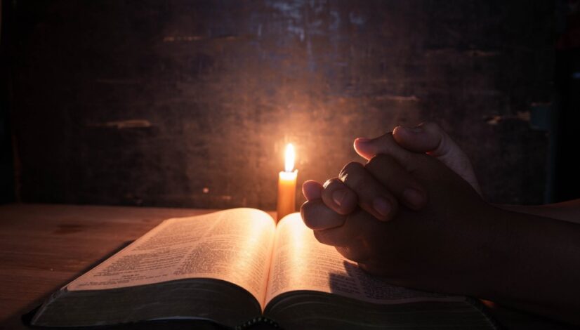 women-praying-bible-light-candles-selective-focus